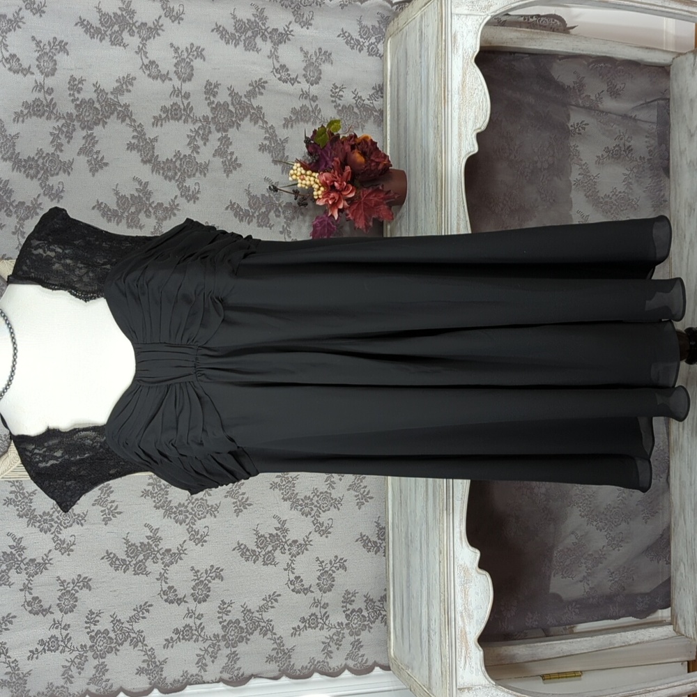 Hayley Matthews black formal dress with lace cap sleeves